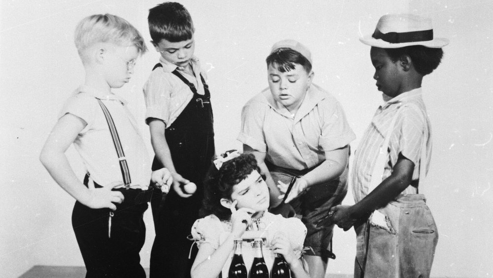 Billy Laughlin, Robert Blake, George McFarland, Billie Thomas and Darla Hood (seated) pose for a promotional portrait for the film series, "Our Gang," or also known as "Little Rascals," in 1940. 