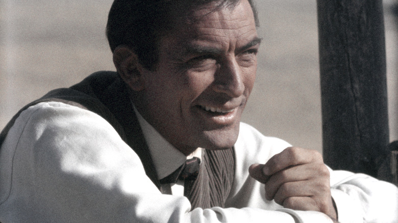 Gregory Peck leaning forward and smiling