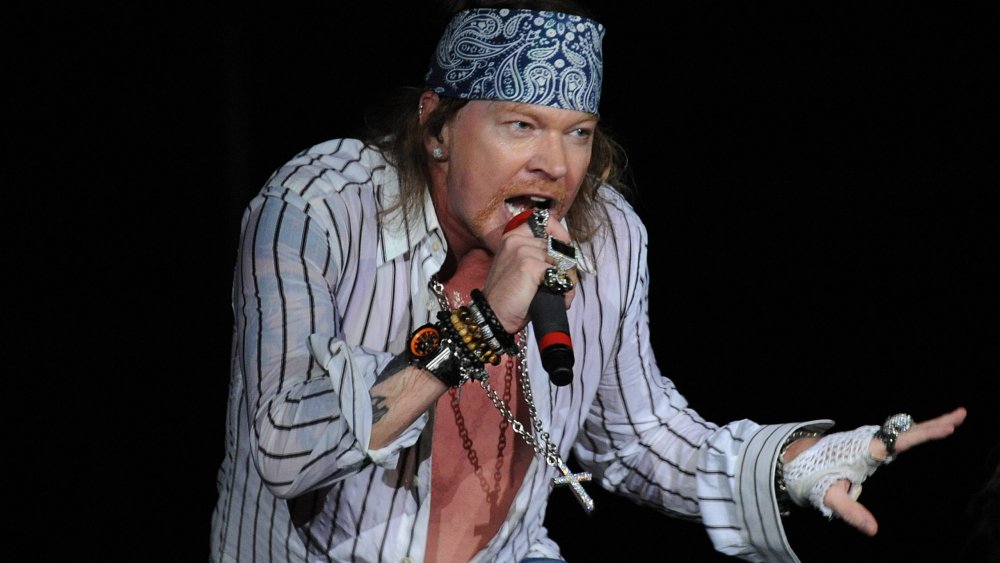 Axl Rose singing into microphone