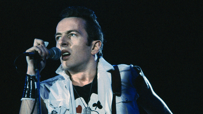 Joe Strummer sneering onstage