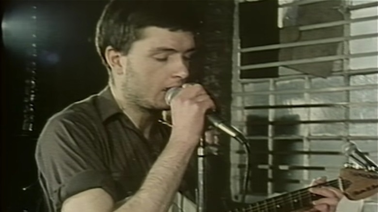 Ian Curtis performing