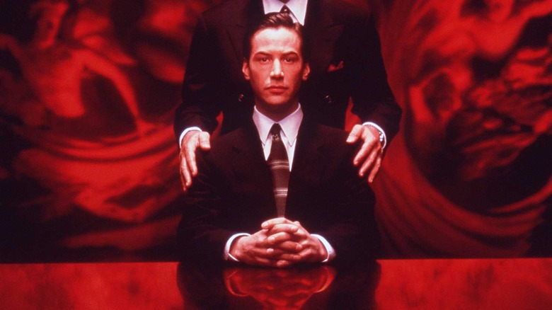 the devil's advocate creepy movie poster