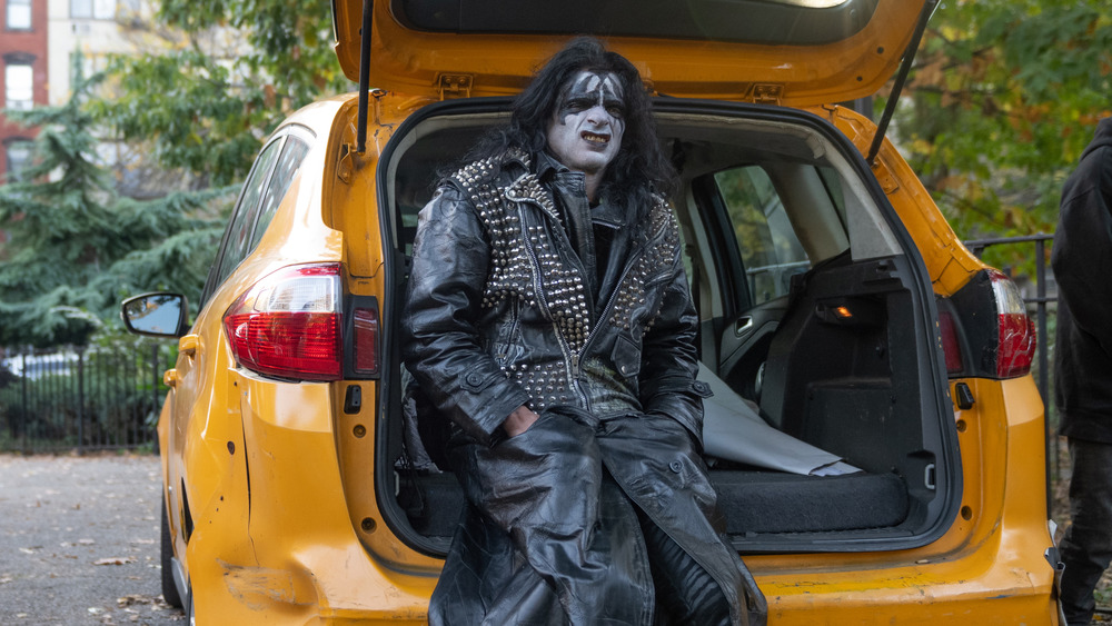 Gene Simmons sitting in car trunk in New York City