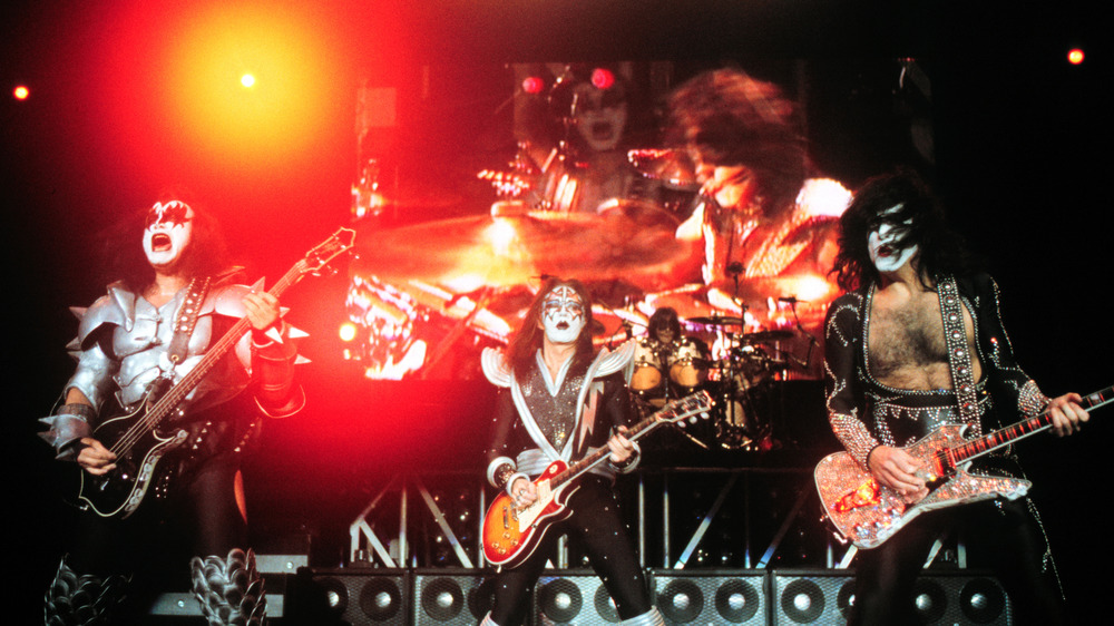 kiss playing onstage in 2000