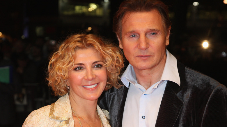 Liam Neeson with Natasha Richardson smiling at event