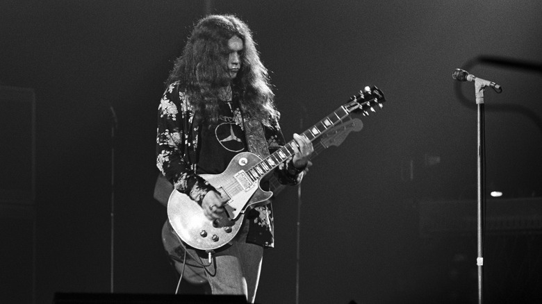Young Gary Rossington playing guitar