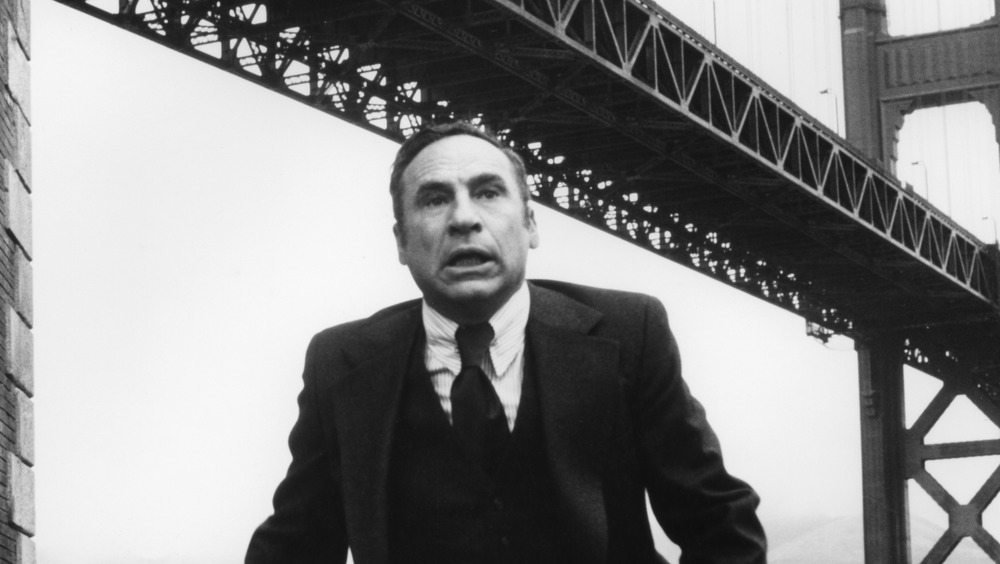 Mel Brooks below a bridge