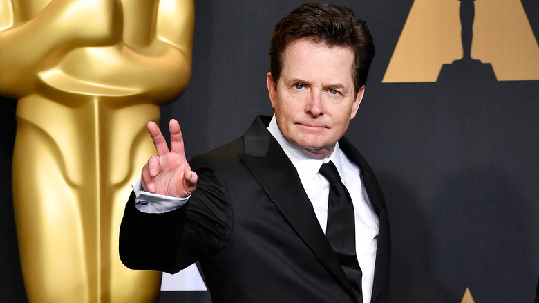 Michael J. Fox raising his hand