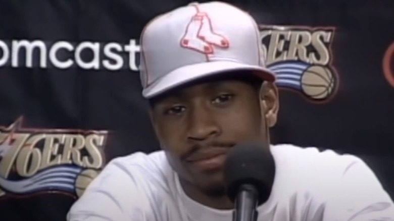 Allen Iverson talking press conference white hat shirt