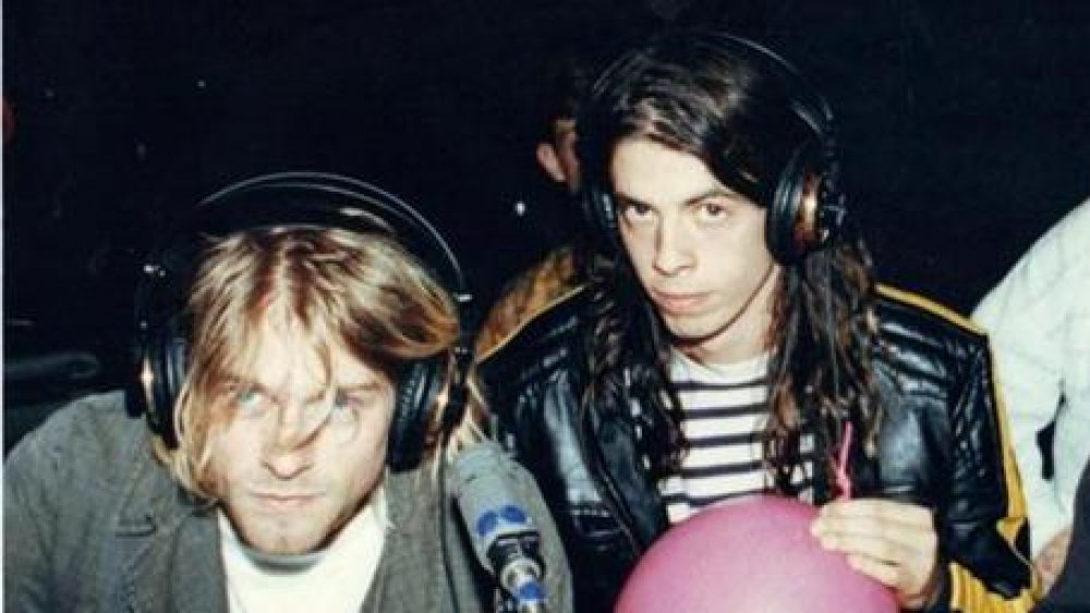 kurt cobain and dave grohl wearing headphones