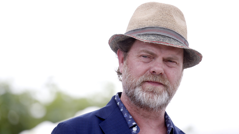 Rainn Wilson outside with a hat