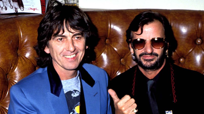 George Harrison smiling and Ringo Starr giving thumbs-up