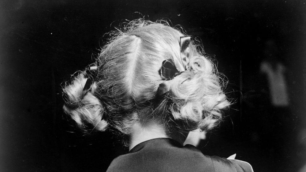 The back of child star, Shirley Temple's head. 