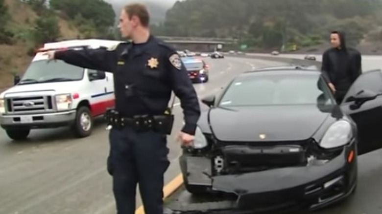 Steph Curry by his crashed Porsche