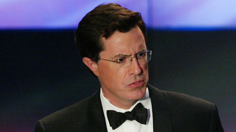 Stephen Colbert frowning while wearing a tuxedo