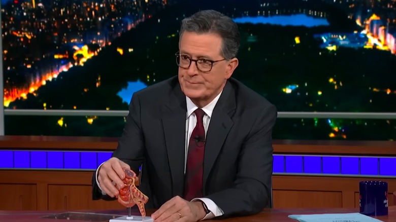 Stephen Colbert displaying model of appendix