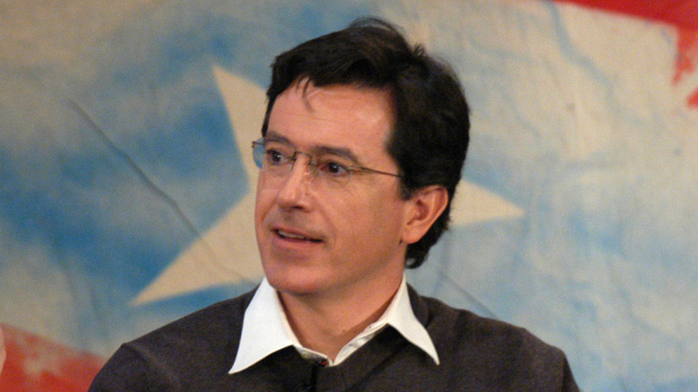 Stephen Colbert pictured in front of a red, white and blue background