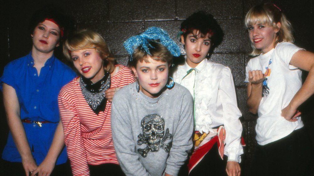 The Go-Gos stood smiling together in the 1980s