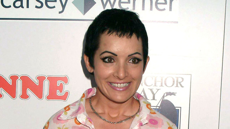 Jane Wiedlin with gritted teeth looking away