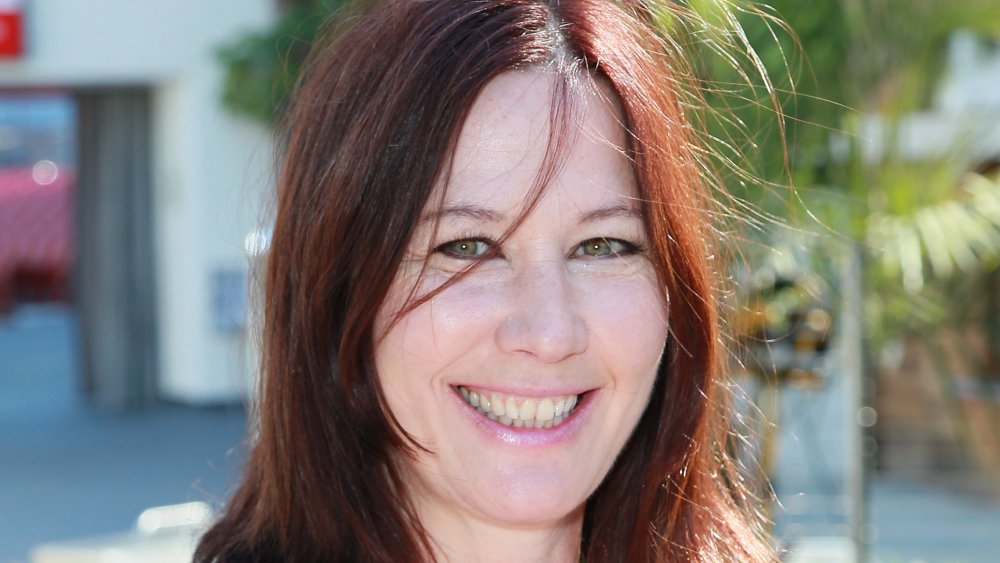 Kathy Valentine smiling outdoors