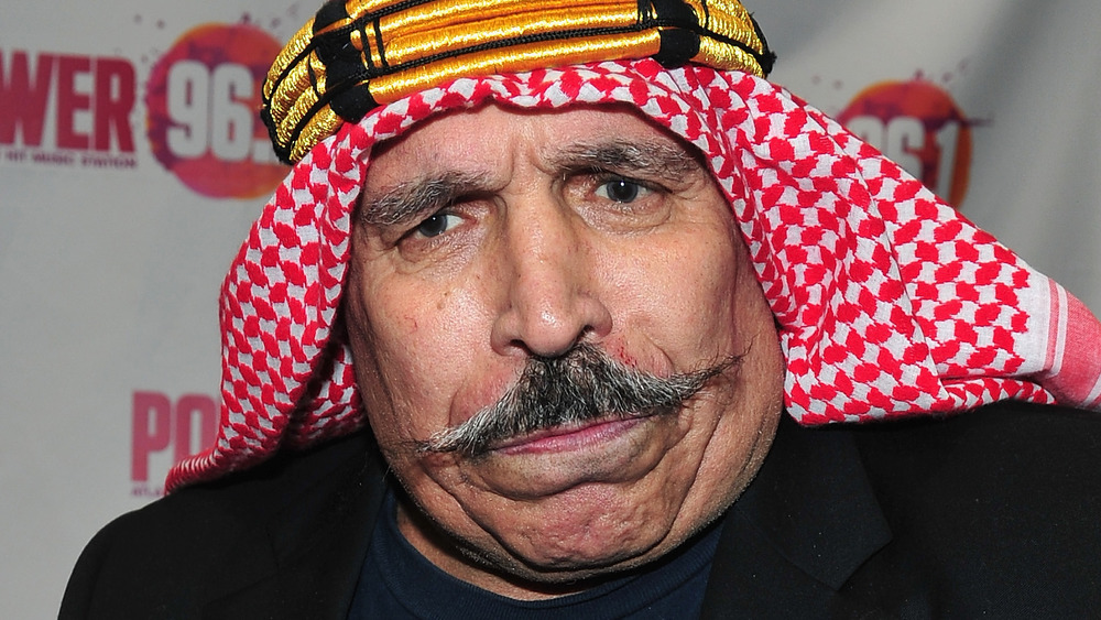 The Iron Sheik in a suit