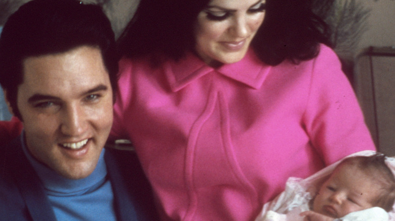 Elvis Presley, Priscilla Presley holding newborn Lisa Marie Presley