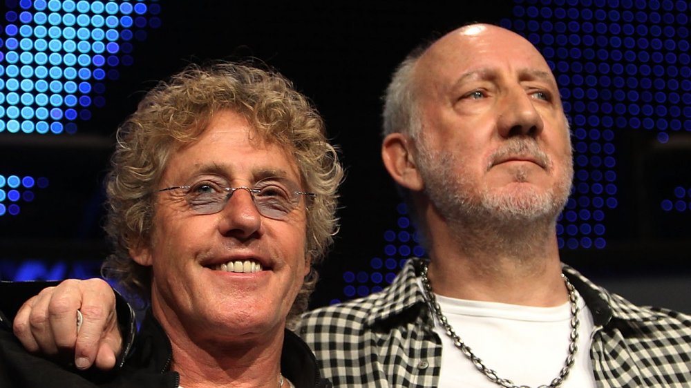 Pete Townshend with his arm around Roger Daltrey