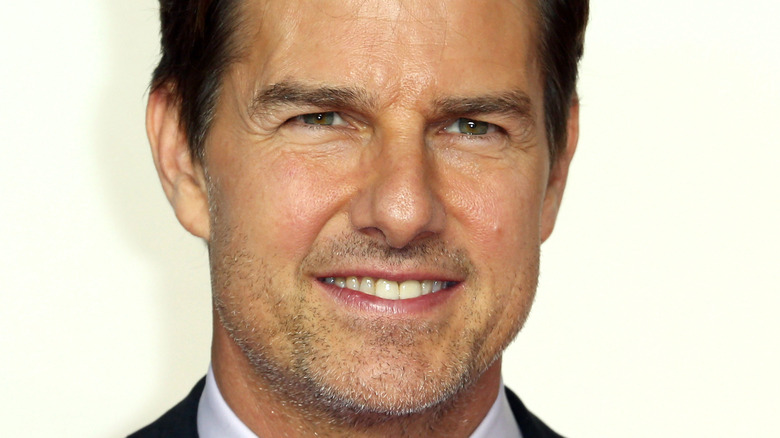Tom Cruise smiling at an event