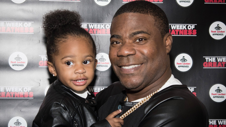 Morgan and his daughter smiling