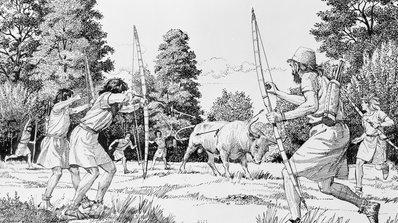 Prehistoric hunters hunting an aurochs