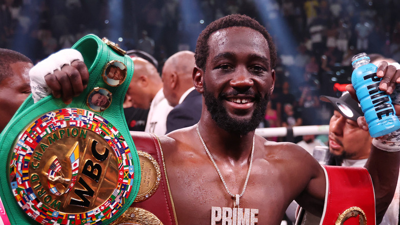 Terence Crawford with championship belts