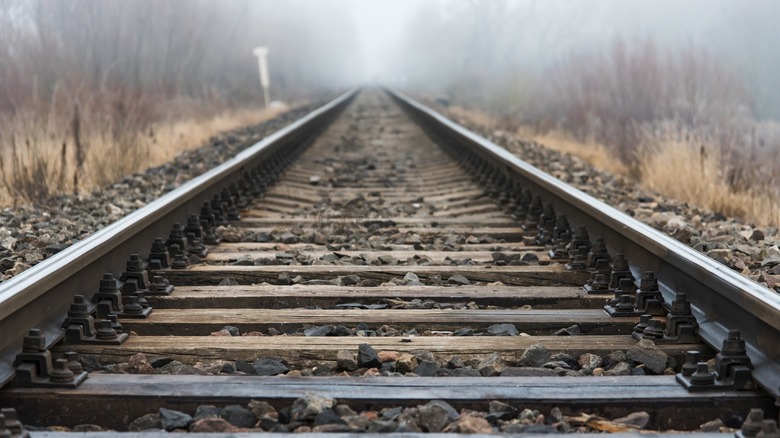 Railroad going into fog