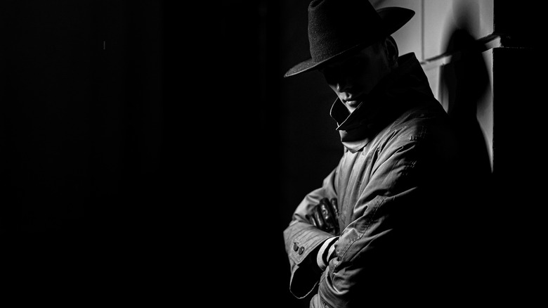 shadow man with a hat