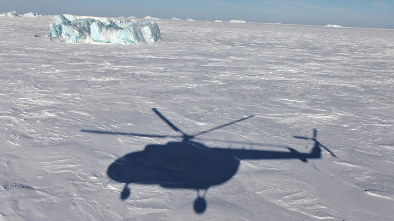 Helicopter's shadow over Antarctica
