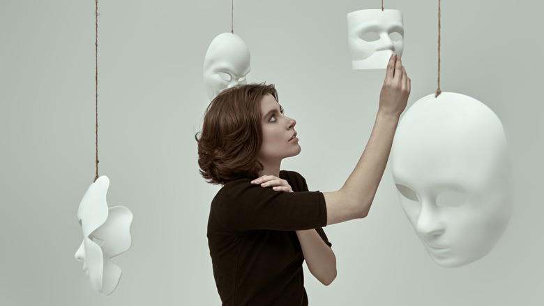 woman looking at masks
