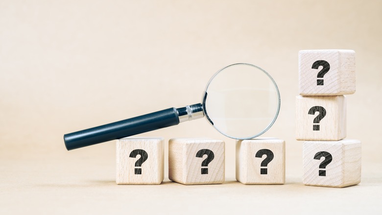 magnifying glass on wooden cubes