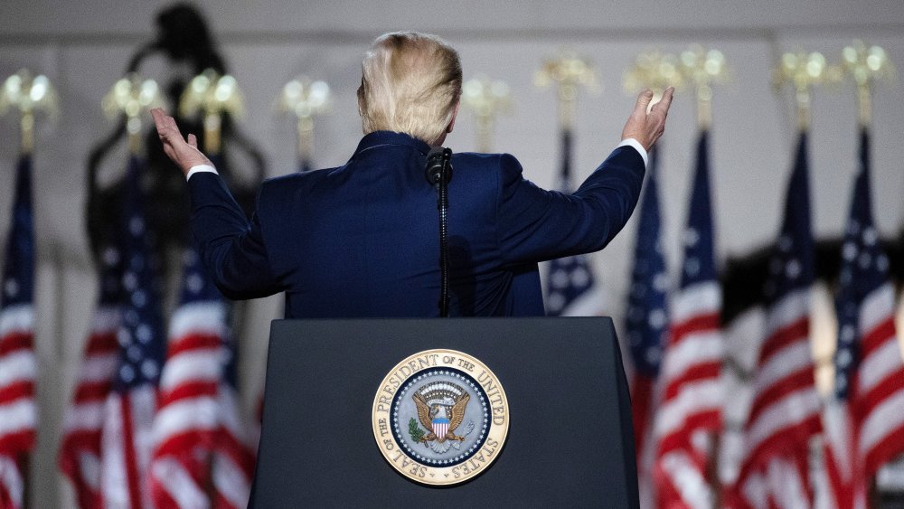 Trump gesturing to flags during RNC acceptance speech