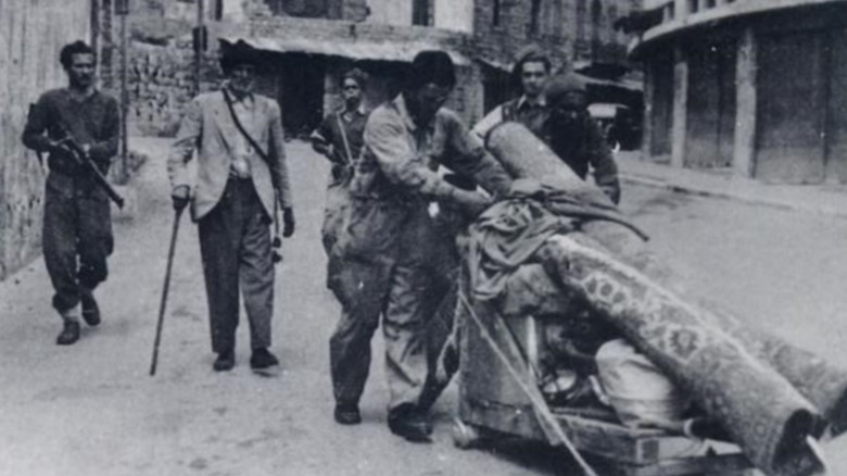 troops forcing Palestinian out on the streets