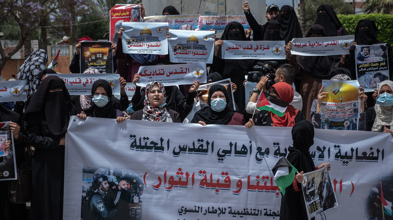 protesters marching with signs