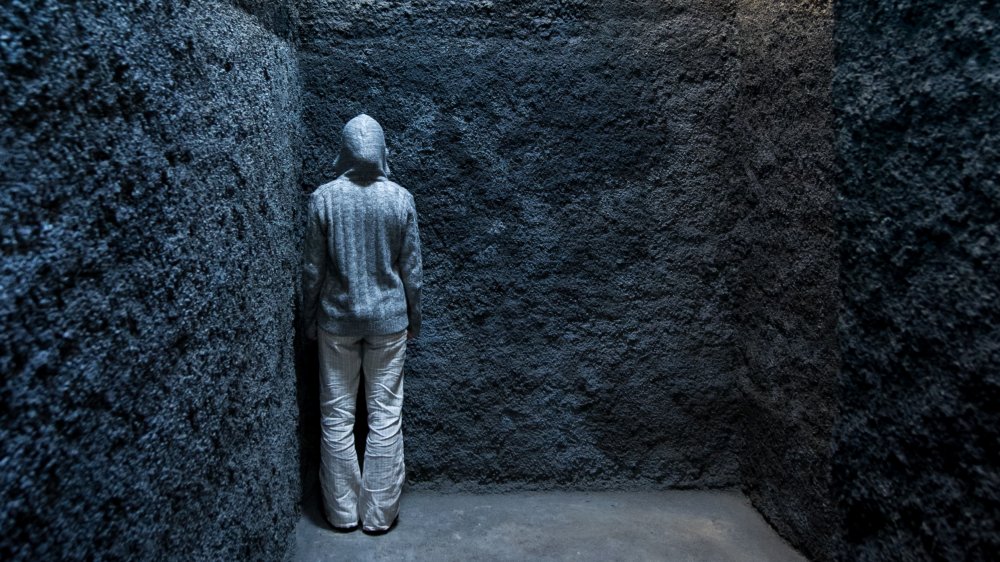 Person in stone room