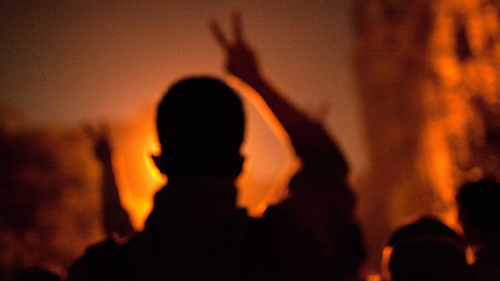 silhouette of a man with peace sign 