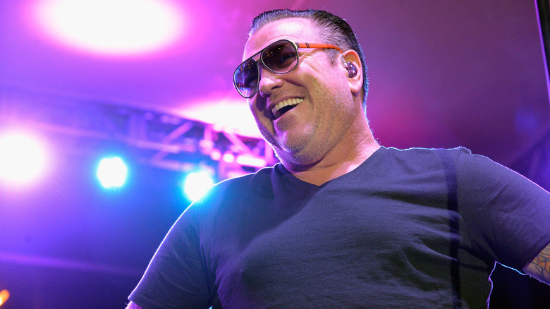 Steve Harwell on stage sunglasses smiling