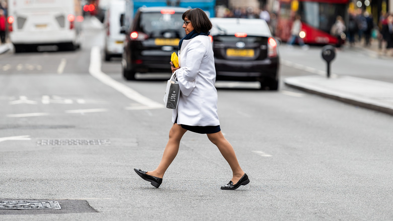 a lady jaywalking