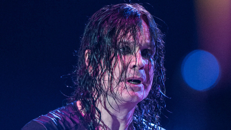 Ozzy Osbourne hair in face