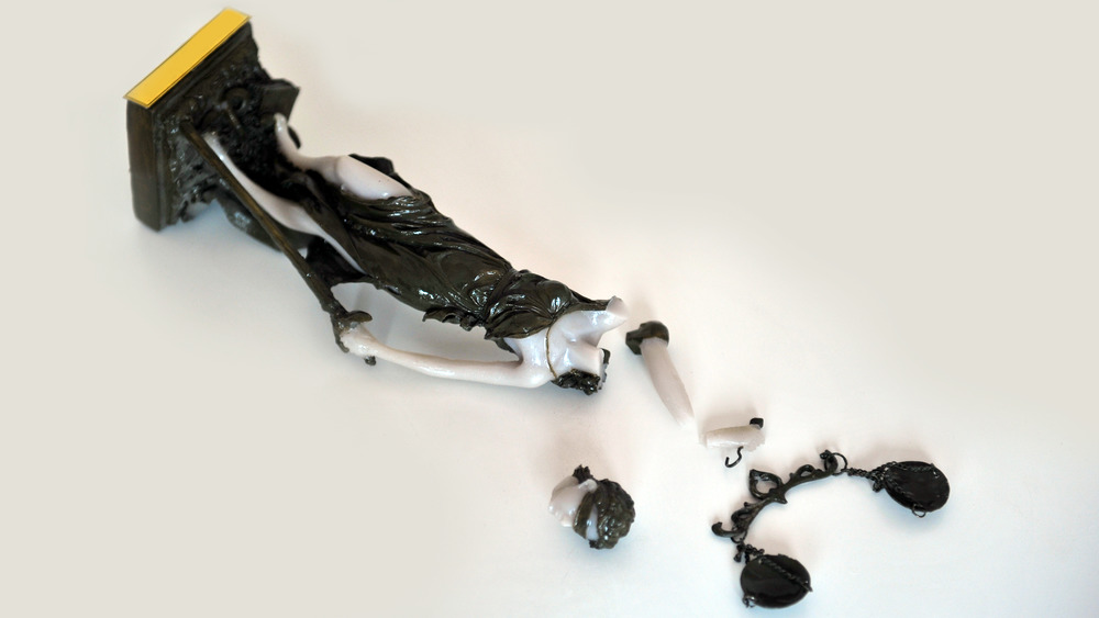 Broken Themis statue represents injustice