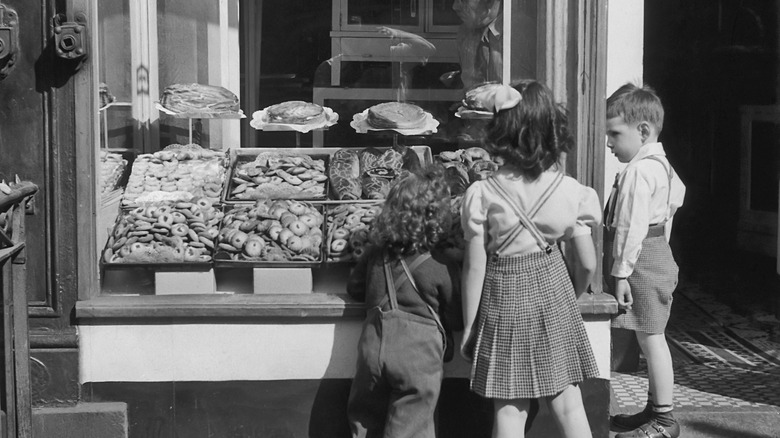 children at bakery window