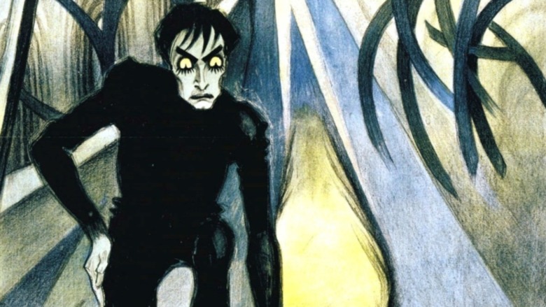 illustration showing monster with yellow eyes in black suit