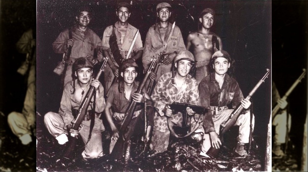Code talkers posing with guns