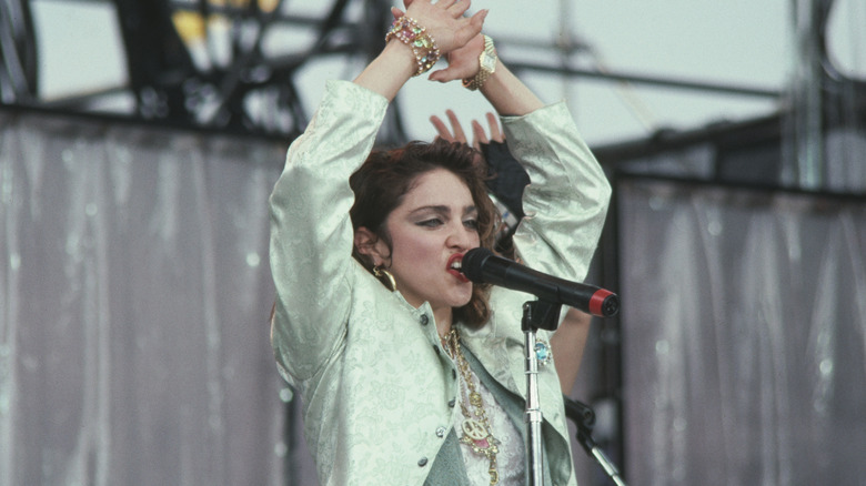 Madonna singing on stage at Live Aid
