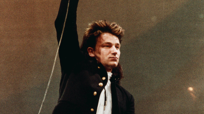 Bono performing with U2 at Live Aid